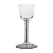 An 18th Century double series opaque twist wine glass, with a wide funnel bowl and central solid