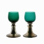 A pair of mid 19th Century Bohemian blue/green glasses, with mercury stems and ribbed feet, marked