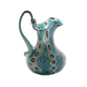 Murano murrine glass jug, circa 1900, by Fratelli Toso, the an arched handle and spout above the