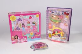 A Barbie fashion designer dough set together with Hello Kitty hamburger diner  We would like to