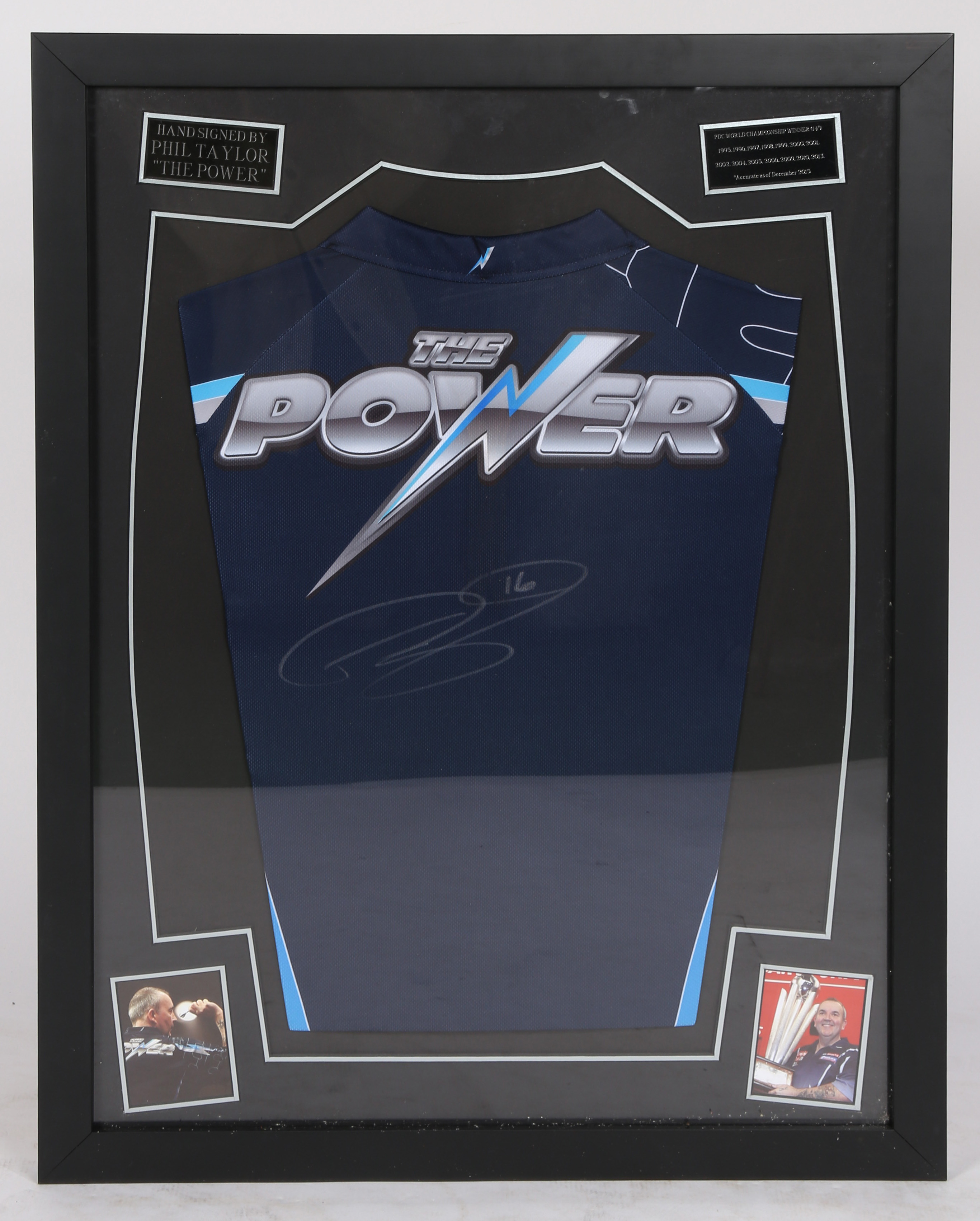 A Signed Phil the power Taylor framed shirt  We would like to thank Donnelly Watson for this lot