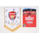 A signed Arsenal Football Club pennant, with certificate of authenticity, 27cm high We would like to