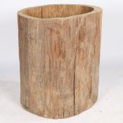 A LARGE FRENCH HOLLOWED OUT TREE TRUNK LOG BASKET.