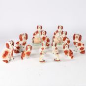 A COLLECTION OF 19TH CENTURY STAFFORDSHIRE SPANIELS (11).