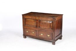 A 18TH CENTURY OAK MULE CHEST.