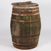 A LARGE EARLY 20TH CENTURY OAK AND IRON BOUND BARREL.