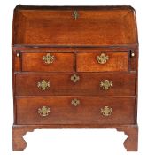 A GEORGE III OAK BUREAU.