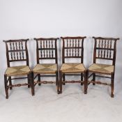 A SET OF EIGHT 19TH CENTURY OAK SPINDLE BACK CHAIRS.