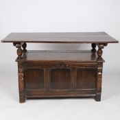 AN 18TH CENTURY AND LATER OAK MONKS BENCH.