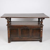 AN 18TH CENTURY AND LATER OAK MONKS BENCH.