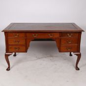 A GEORGE III STYLE MAHOGANY WRITING DESK.