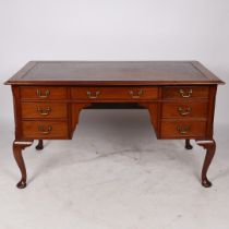 A GEORGE III STYLE MAHOGANY WRITING DESK.