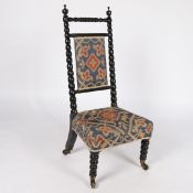 A 19TH CENTURY EBONISED CHAIR.