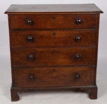 A VICTORIAN OAK CHEST OF DRAWERS.