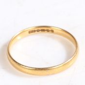 A 22 CARAT GOLD WEDDING BAND.