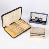 A SILVER CIGARETTE BOX, A CASED TEASPOON, A CASED SET OF SIX FRUIT KNIVES (3).