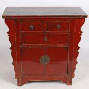 A 20TH CENTURY CHINESE RED PAINTED CABINET.
