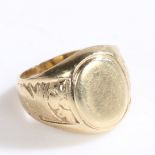 A 9 CARAT GOLD SIGNET RING.