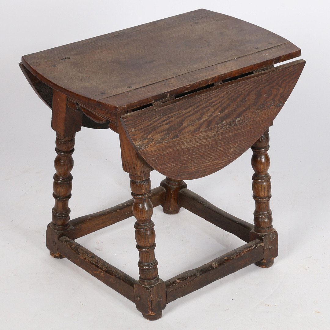 A 17TH CENTURY AND LATER STOOL-TABLE.