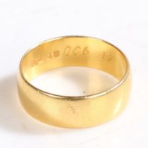 A 22 CARAT GOLD WEDDING BAND.