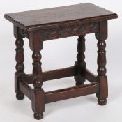A 17TH CENTURY STYLE OAK JOINT STOOL.