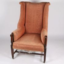 A 19TH CENTURY WING ARMCHAIR.