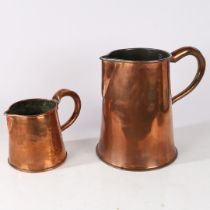 A LARGE 19TH CENTURY COPPER JUG AND A SMALLER EXAMPLE (2).