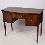 A REGENCY MAHOGANY BOW FRONTED SIDEBOARD.