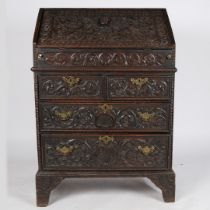 A 19TH CENTURY OAK BUREAU IN THE 17TH CENTURY MANNER.