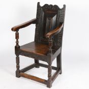 A 17TH CENTURY AND LATER OAK WAINSCOTT CHAIR.