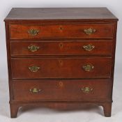 A GEORGE III OAK CHEST OF DRAWERS.