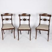 A SET OF THREE REGENCY ROSEWOOD AND BEECH AND BRASS INLAID CHAIRS.