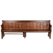 A 19TH CENTURY OAK PEW.