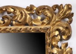 18th/19th century carved Florentine picture frame containing a mirror - rebate size 28in x 20in