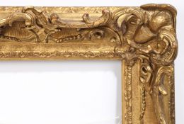 18th century heavily carved and swept picture frame - rebate size 16in x 14in