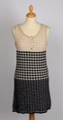 A Chanel sleeveless dress and cardigan set, knitted cotton with metallic buttons. Size 34.