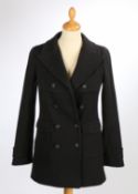 A Chanel wool knit double breasted coat with star buttons and large front pockets, size 34.