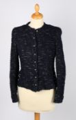 A Chanel navy blue bouclé metallic tweed jacket with simulated pearl buttons, size 34.