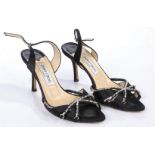 A pair of Jimmy Choo black satin strappy heeled sandals with diamante decoration. Size 36