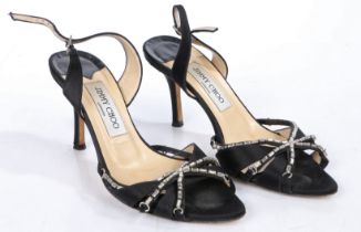 A pair of Jimmy Choo black satin strappy heeled sandals with diamante decoration. Size 36