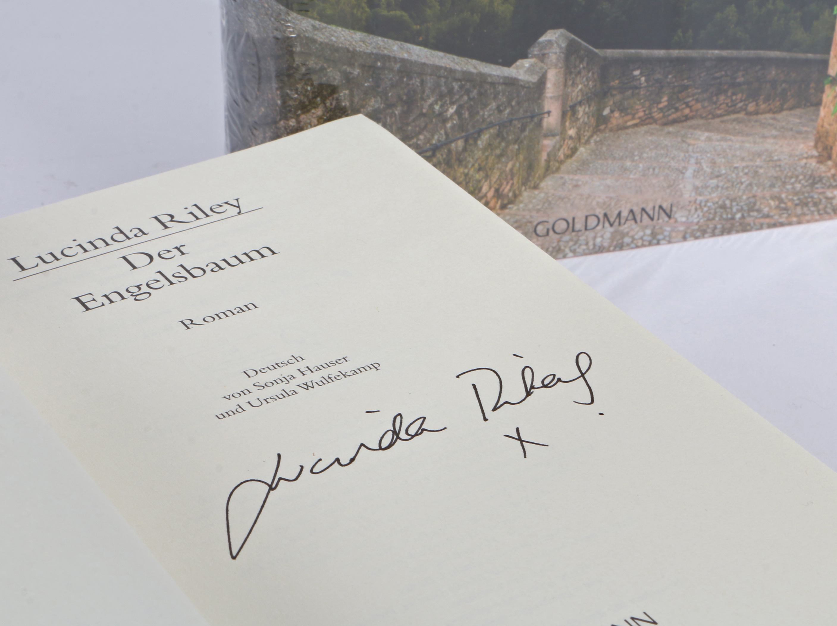 Lucinda Riley signed, German first edition of ‘The Angel Tree’ (paperback) and an unsigned, - Image 2 of 2