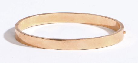 A 15 carat gold bracelet, of plain form with push button mechanism, 60.4mm wide, 8.4g