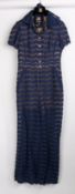 A Chanel navy lace short sleeved jumpsuit with beige silk lining and gilt CC buttons, size 34.