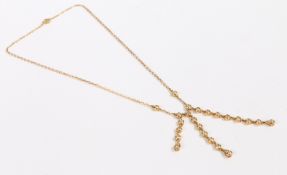 An 18 carat yellow gold and diamond necklace, the oval chain-link necklace set with three