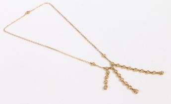 An 18 carat yellow gold and diamond necklace, the oval chain-link necklace set with three