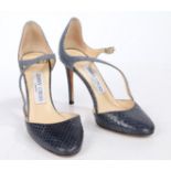 A pair of Jimmy Choo blue snakeskin high heels, size 35.