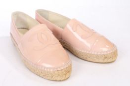 A pair of Chanel pastel pink leather espadrilles with embroidered CC logo, size 36.