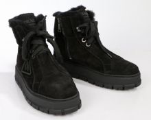 A pair of Prada black suede sheepskin boots with platform sole. Size 36