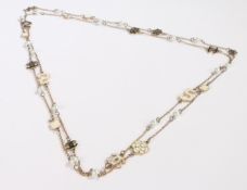 A Chanel No.5 necklace, the gilt chain-link necklace with white and black enamel stylised