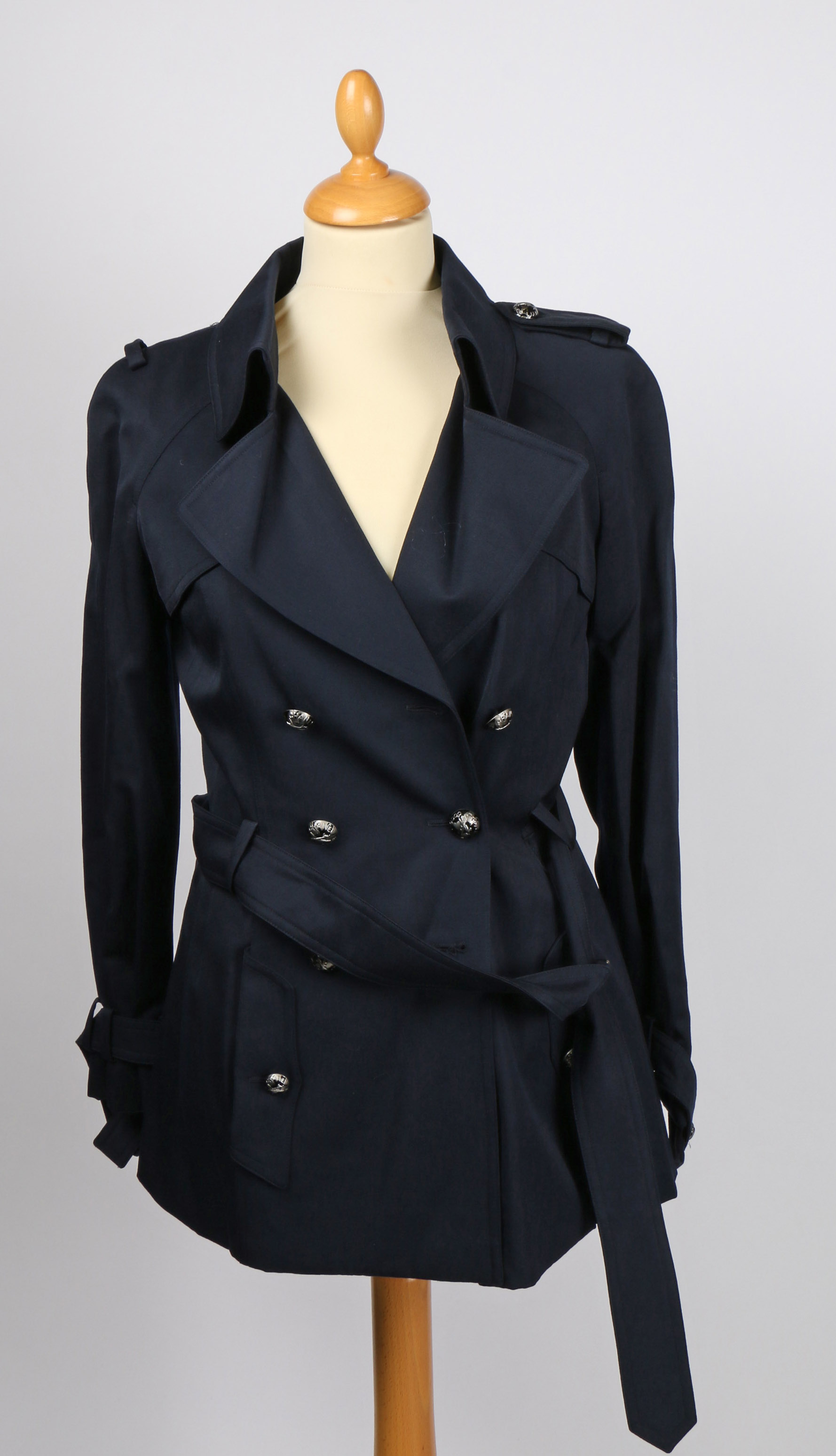 A Chanel cotton navy double breasted short mackintosh coat, size 34.